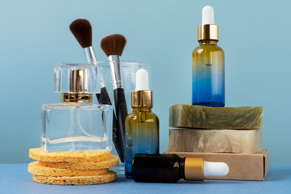 Beauty products and cosmetics displayed on a vibrant blue background, offering a colorful and enticing array of personal care items.